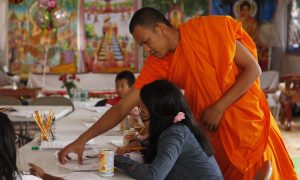 Monk teaching local youth Khmer language