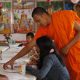 Monk teaching local youth Khmer language