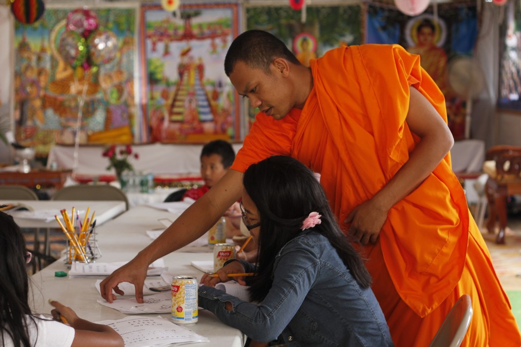 Monk teaching local youth Khmer language